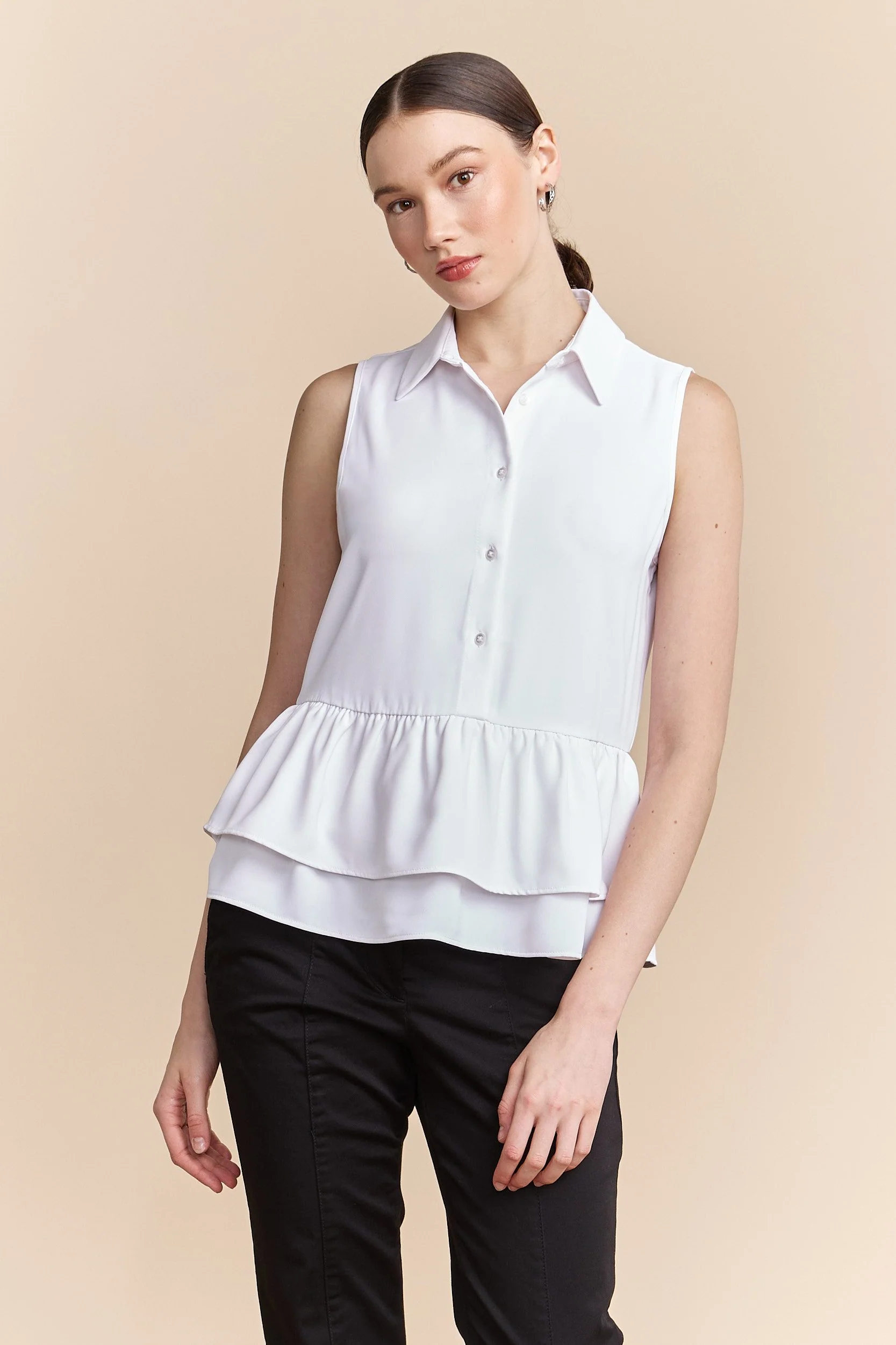 Sleeveless blouse with ruffles at bottom